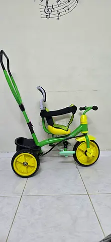Green kids tricycle - sturdy metal frame, good condition