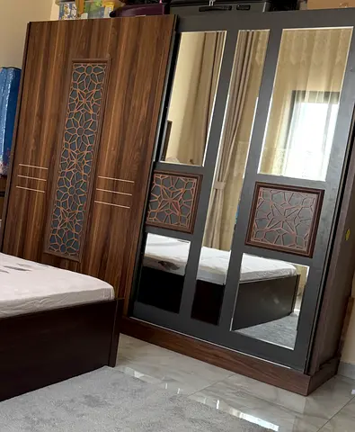 Dark wood 2 door wardrobe with mirrors and carved panels  sliding door