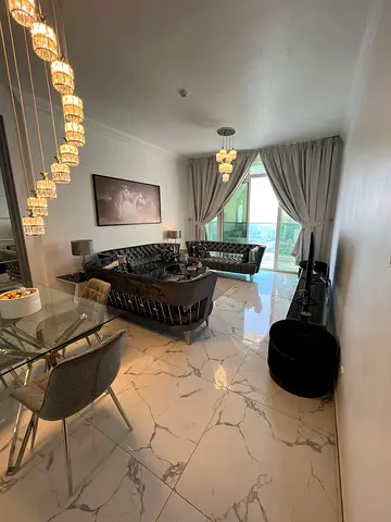 Fully furnished 3-bedroom apartment with a living room for monthly rent in Ajman – Al Rashidiya ✅ Bills and internet included with gym, pool, parking.