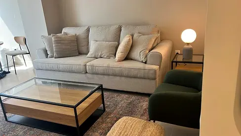 Glass top coffee table with wood