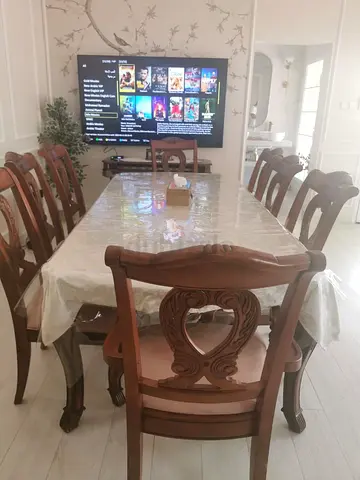 Wooden dining table with 8 chairs