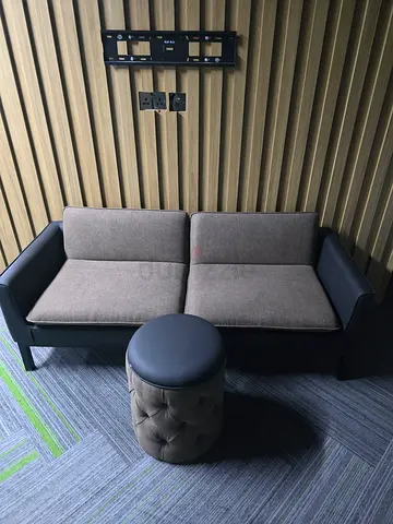 Compact 2-seater sofa in good condition with ottoman