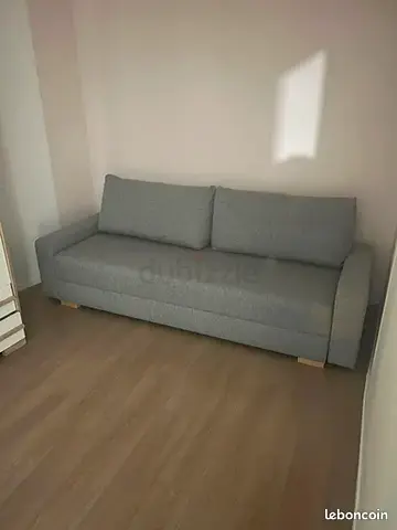 Grey 3-seater sofa bed in good condition — compact and comfortable