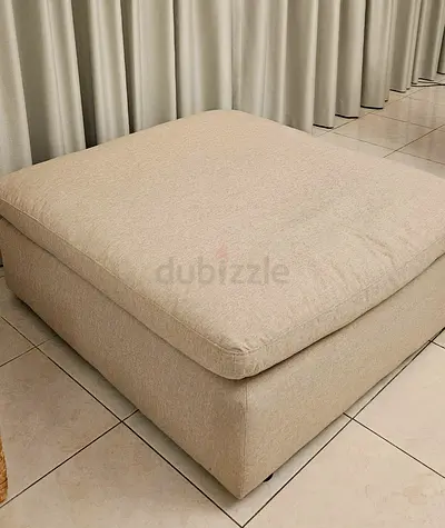 Large beige fabric ottoman / footstool - good condition