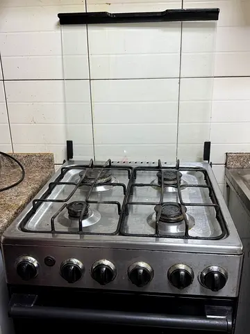 Used stainless steel 4-burner gas stove with oven - good working condition