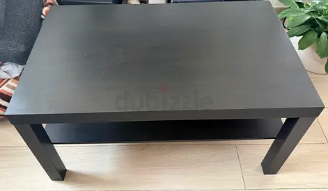 Simple black wooden coffee table with lower shelf - good condition