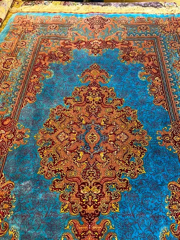 Blue handmade Persian-style area rug in good used condition
