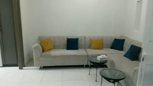 A spacious studio apartment divided into a room and a living room, furnished to a high standard, with a separate kitchen and bathroom. High-end finish