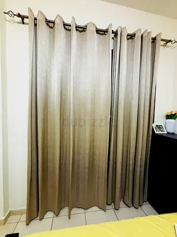 Beige textured blackout curtains with eyelet header - set of 2 panels