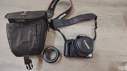 Canon camera with lens, adapter ring and carrying case - good condition
