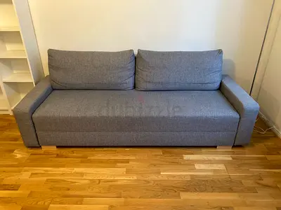 Grey 3-seater fabric sofa bed in good condition