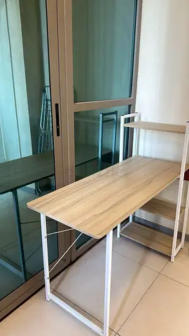 Used ergonomic office desk and an office chair with armrests and wheels