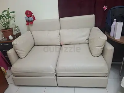 Cream 2-Seater Leather Sofa convertible to bed in Excellent Condition
