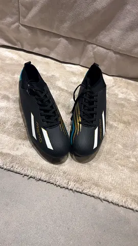 Men's black football (soccer) cleats