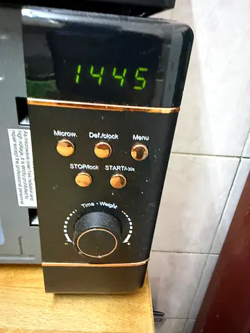 Compact black countertop microwave oven - working condition