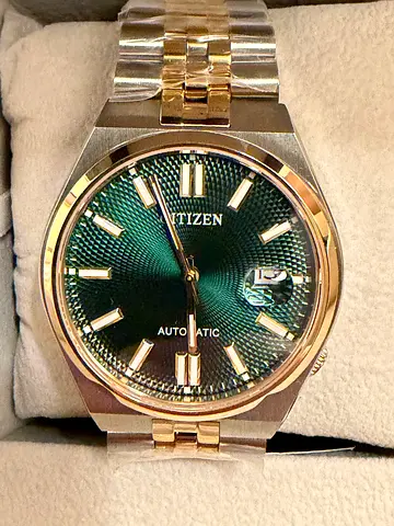 Citizen automatic men's watch with green dial and two-tone steel bracelet