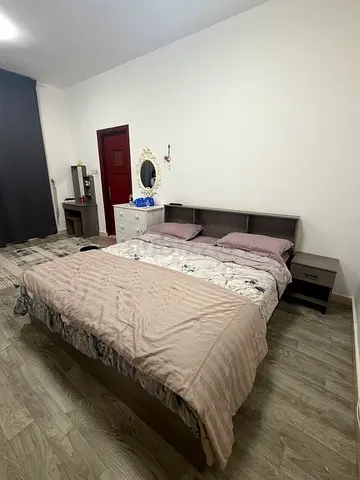 Queen bed frame with headboard and two bedside tables - good condition