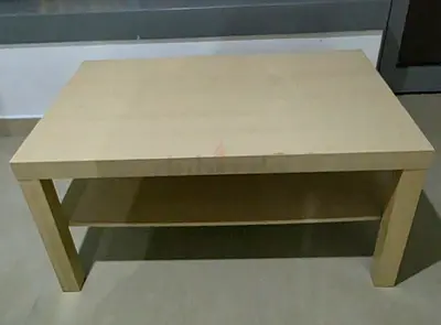 IKEA light wood coffee table with lower shelf