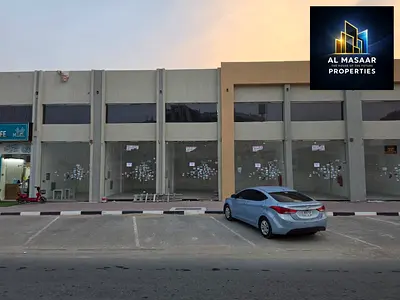 For sale: A commercial building comprising four ready-to-use shops, located directly at Al-Zahi Roundabout. It occupies a prime location, and the pric