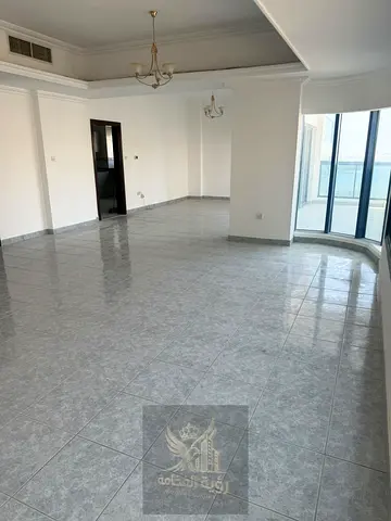 For Rent in Sharjah, Al Majaz 2 A beautifully designed two-bedroom apartment with a spacious living room, including a master bedroom. The apartment o