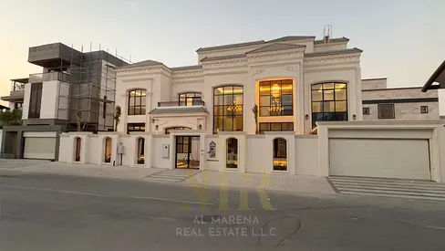 Luxury villa with high-end custom finishes, featuring a swimming pool, elevator, and spacious rooms. Located in Al Zahia, Ajman. Includes electricity,