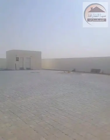 For sale: A fenced plot of land in Al Sajaa Industrial Area, Sharjah. Ownership is restricted to UAE and GCC nationals only. The land is located on a