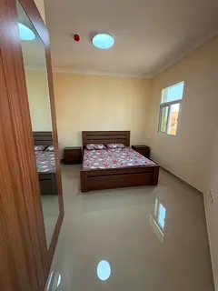 Two bedrooms and a living room, annual rent in Al Jerf, second occupancy, built-in wardrobes, open b