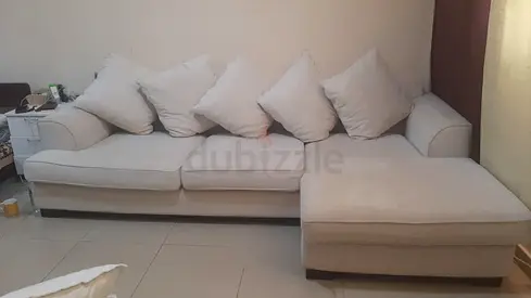 Light beige L-shaped fabric sofa with chaise, seats 4-5
