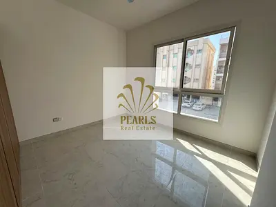 Annual rent in Ajman Al Nakheel near Corniche, brand-new first tenant, 1 master bedroom + hall, 2 baths, balcony, central AC, wardrobes, prime locatio