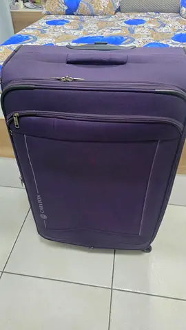 Carlton Purple large-sized softshell roller suitcase - good condition