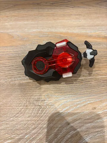 Small spinning top launcher toy with removable top (used)