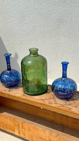 Decorative glass vases set — green bottle and two blue patterned vases