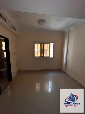 Spacious studio in Abu Shagara featuring a large layout, a neat and clean kitchen, a bathroom with high-end finishes, central gas A/C, and an excellen