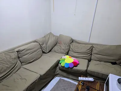 L-shaped olive green fabric corner sofa - good condition