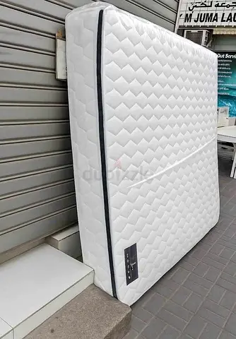 Queen-size mattress in good condition — firm support