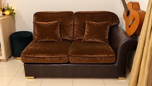 2-seater brown velvet and leather-look sofa in good condition
