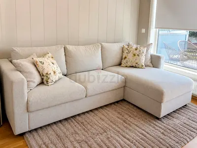 Light beige L-shaped fabric sofa with chaise - good condition