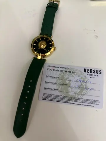 Versus Versace green strap gold-tone Medusa watch with warranty card