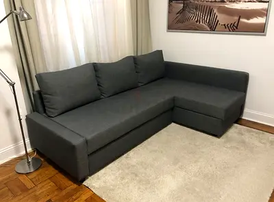 Grey L-shaped fabric sofa - good condition