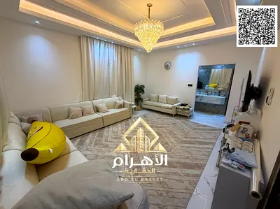 Villa for sale in Al Yasmeen, Ajman—equipped with electricity and air conditioning. It features 5 master bedrooms, a majlis, a living area, and a maid