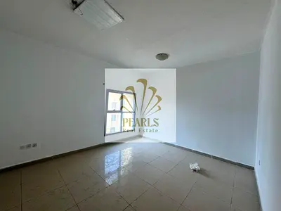 2-bedroom apartment with hall for annual rent in Ajman Corniche Towers, maid’s room, open view, prime location close to all services, ideal for famili