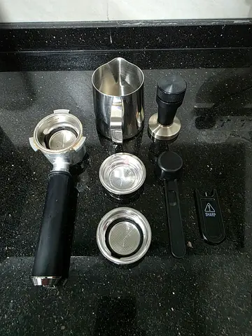 Delonghi coffee machine set with tamper and milk frothing pitcher - used