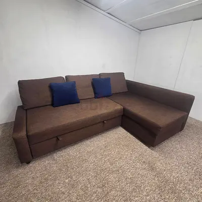 Modern Brown L-Shaped Sofa Bed with Blue Pillows