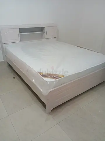 White wooden double bed with headboard storage - good condition