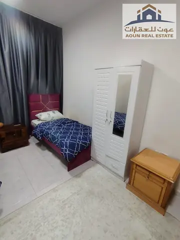 Fully furnished 2-bedroom + living room apartment in Al Sharanj (Al Taawun). Rent is 40,000; key money is only 7,000. No security deposit required; fe