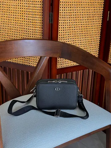 Compact black crossbody bag with adjustable strap