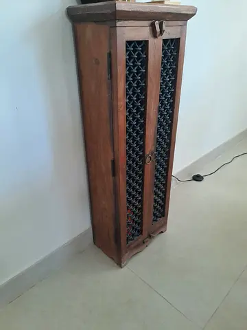 Tall Narrow Wooden Cabinet with Decorative Lattice Doors