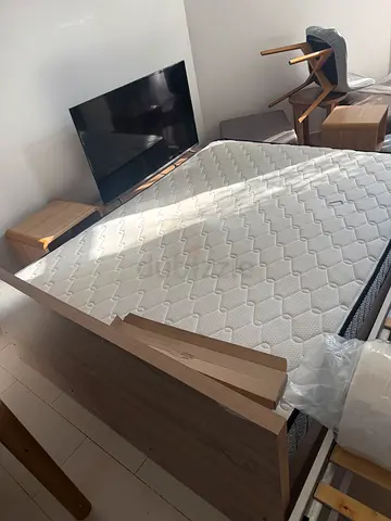 Wooden bed and mattress