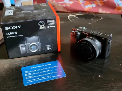 Sony A6400 mirrorless camera with 16-50mm kit lens and box