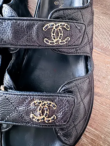 Chanel black leather slingback sandals with gold-tone CC logo. Size 39.5
